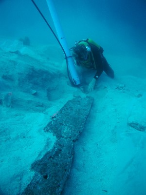 Figure 4. Excavation of the sixth-century-BC shipwreck at Pabuç Burnu, Turkey. Study of the assemblage has suggested a cargo of primarily agricultural goods stored in amphorae that circulated regionally within the south-east Aegean, while the remains of the hull reveal a laced construction technique appropriate for a modest venture (see Greene <em>et al.</em> 2008; photo courtesy of the Institute of Nautical Archaeology).